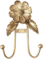 Decorative gold hook with floral design on a white background