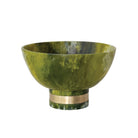 Green marble bowl with gold band on a white background