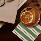 Mocha drink with a lemon slice on a wooden table with a striped napkin.