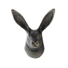 Decorative rabbit head sculpture on a white background