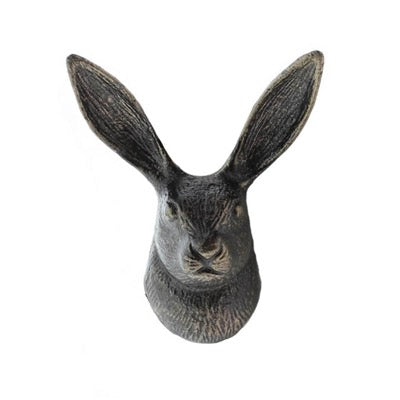 Decorative rabbit head sculpture on a white background