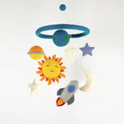 Children's mobile with solar system-themed hanging toys on a white background