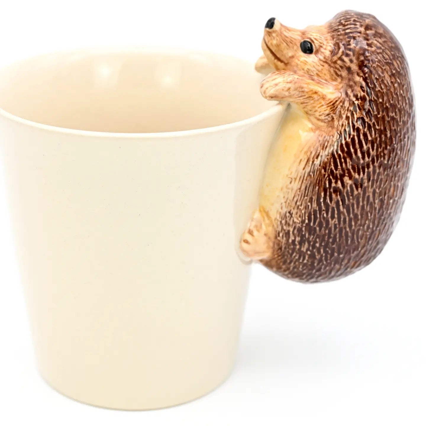 Hedgehog-shaped cup holder on a white background
