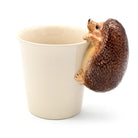 Hedgehog-shaped mug holder on a white background
