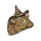 Bronze bull head sculpture on a white background