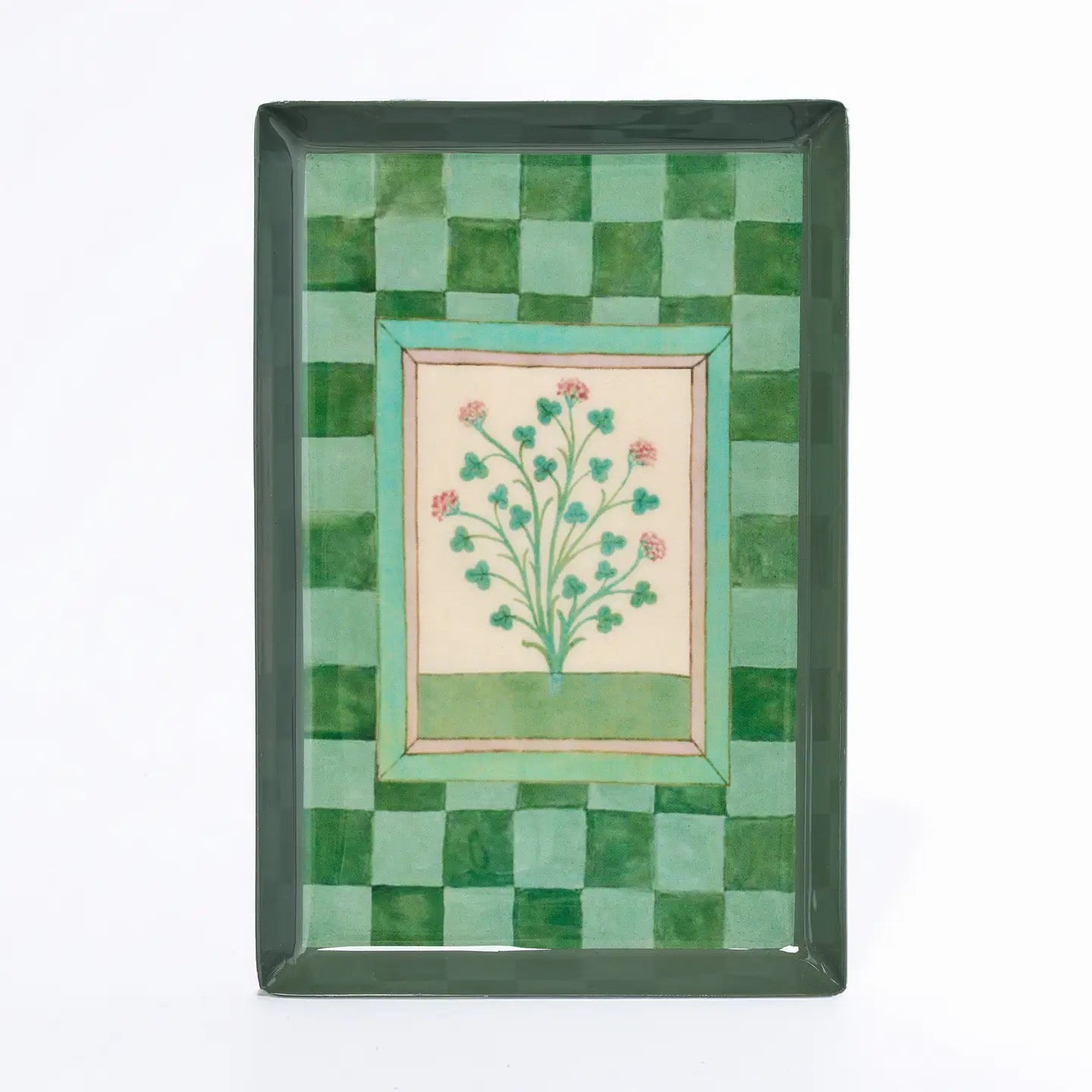 Decorative tray with green mosaic border and floral design in center on a white background