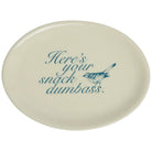An oval ceramic plate in cream with blue text reading 'Here's your snack dumbass.' and a blue bird illustration, shown on a plain white background.