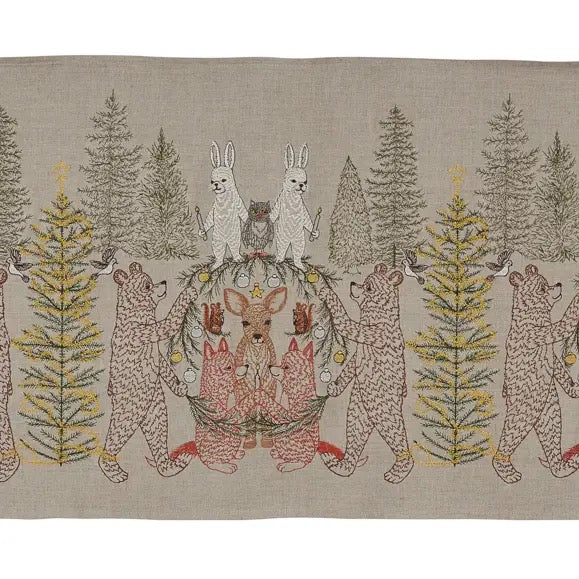 Decorative fabric panel with embroidered animals and trees on a beige background