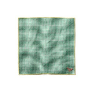 Green checkered fabric square with a brand logo in the corner on a white background
