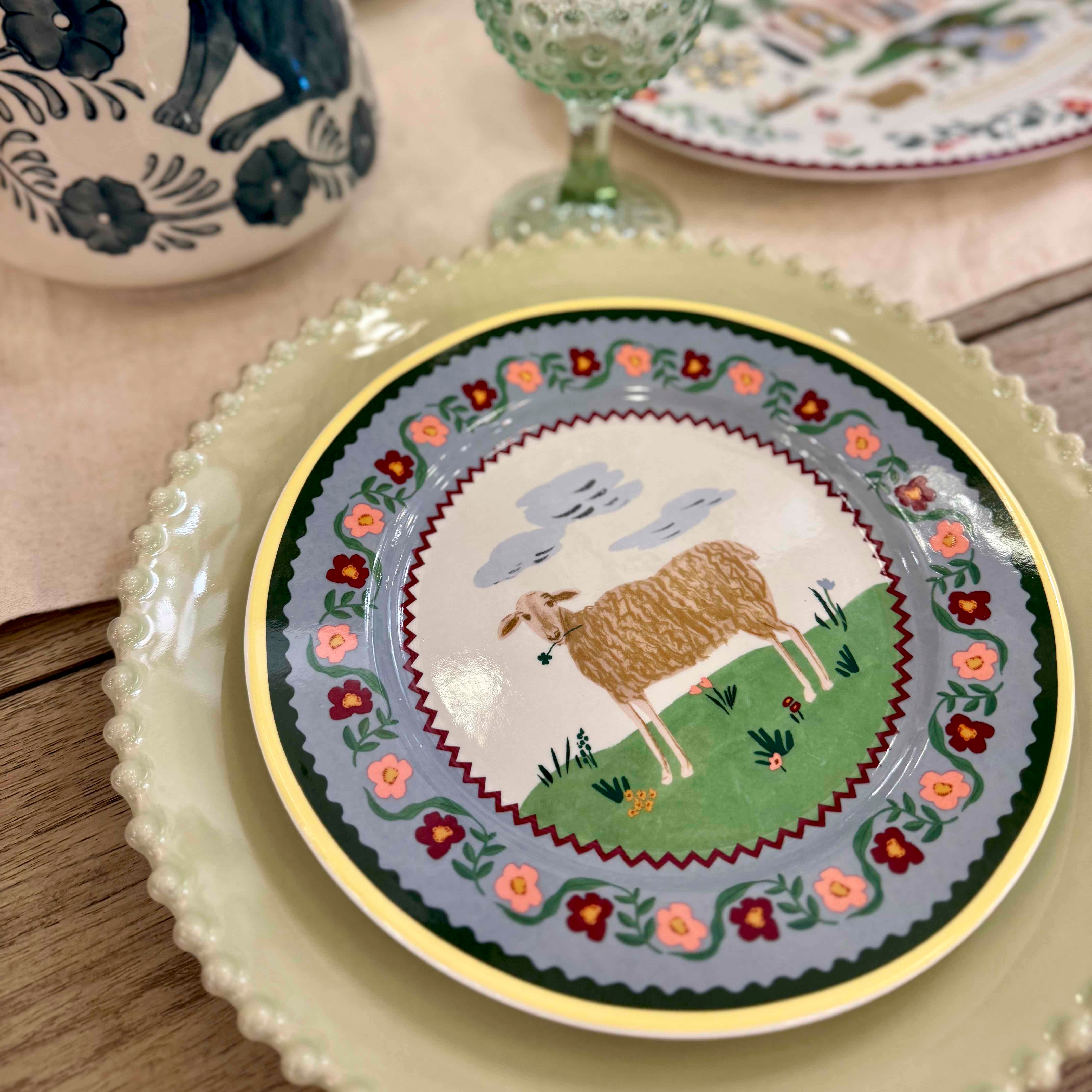 Decorative plate with a sheep design on a table