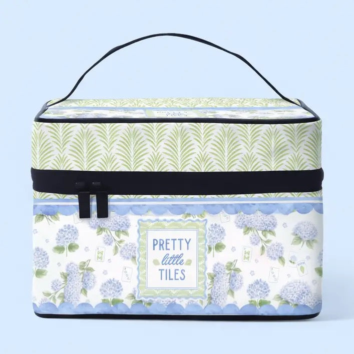 Storage box with floral design and 'Pretty Little Tiles' text on a light blue background