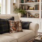 Beige sofa with plaid and dog-themed pillows in a living room setting.