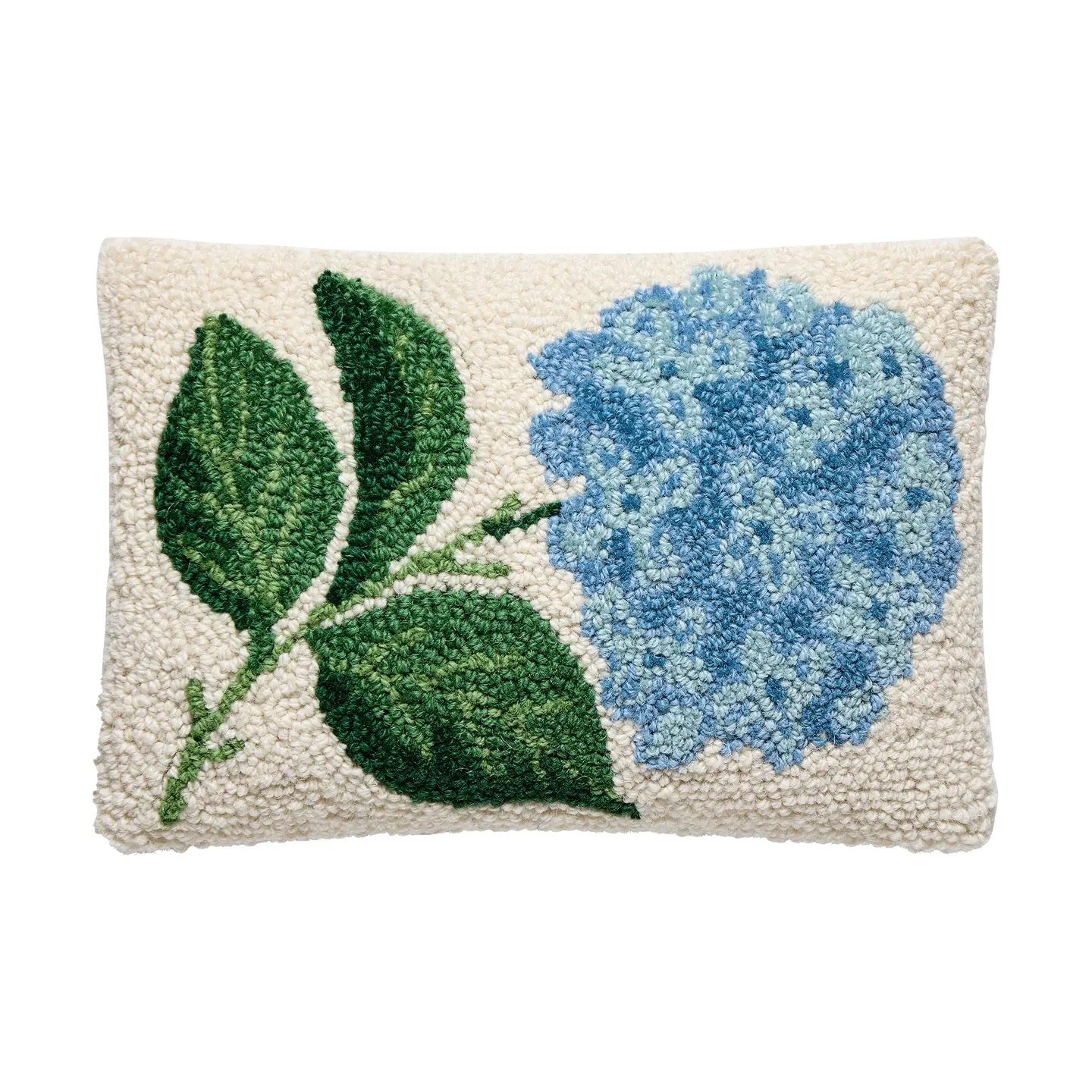 Decorative pillow with blue flower and green leaves on a white background