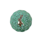 Decorative plate with a rabbit design on a green background