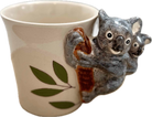 Ceramic mug with a koala design on a white background