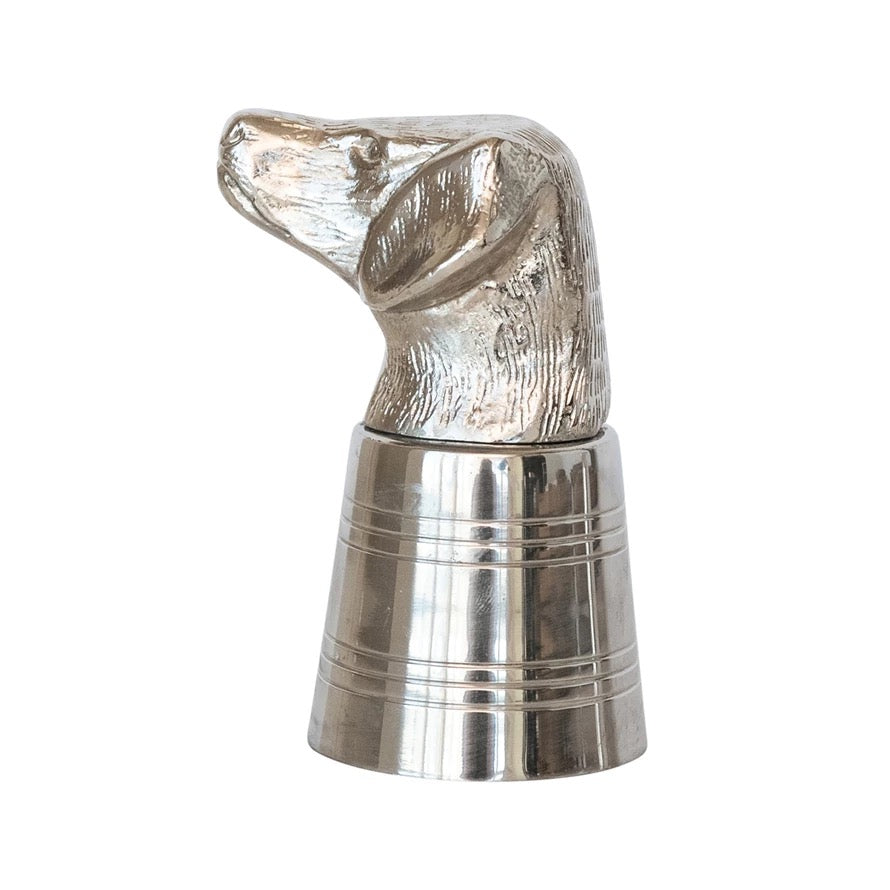 Metallic dog-shaped object on a white background