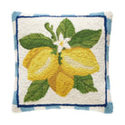 Decorative pillow with lemon design on a white background