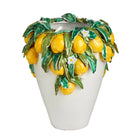 Decorative vase with lemon design on a white background