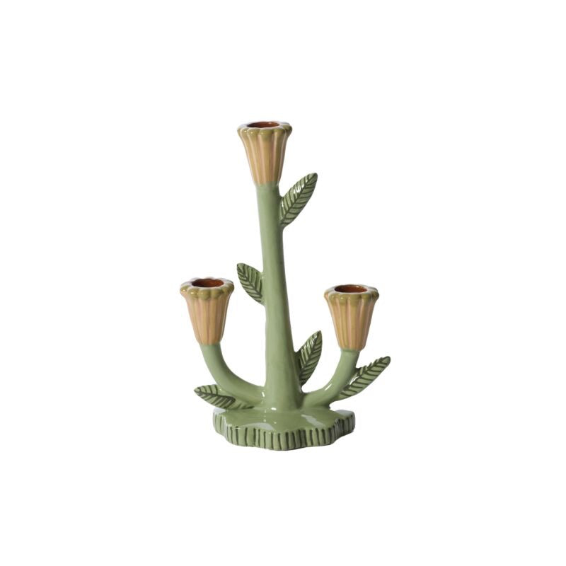 Decorative candle holder with leaf design on a white background