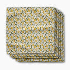 Stack of folded fabric with lemon pattern on a white background