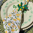 Napkin with lemon pattern on a decorative plate