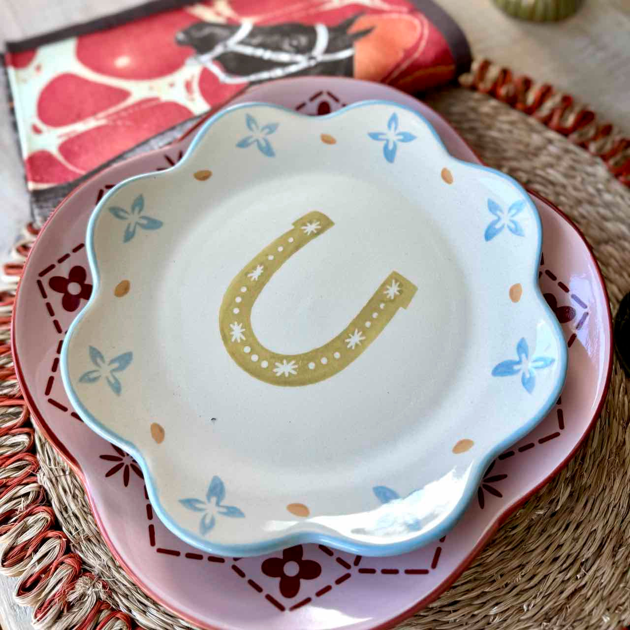 Decorative plate with a horseshoe design on a textured surface