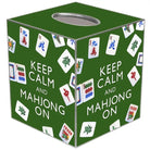 A green Mahjong-themed box with white text reading 'KEEP CALM AND MAHJONG ON' and printed Mahjong tiles around the surface, shown on a white background.