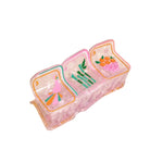 Pink plastic container with colorful designs on a beige background