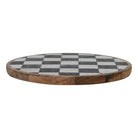 Round wooden board with a checkered pattern on a white background