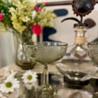 Decorative glassware with floral arrangement on a table