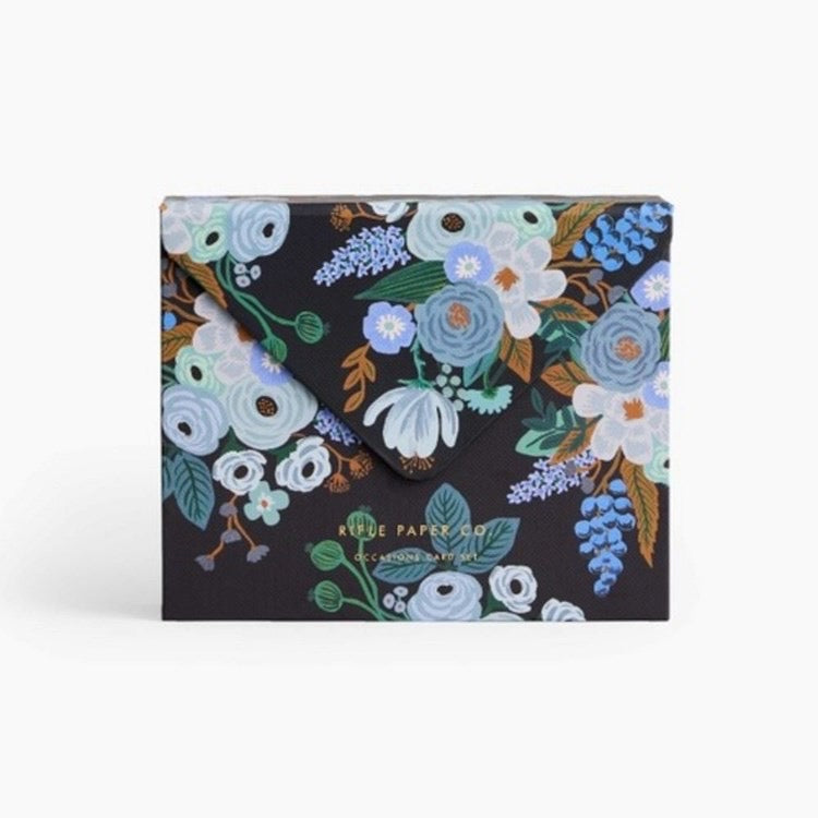 Floral-patterned product packaging with 'Rifle Paper Co.' branding on a white background