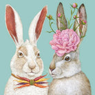 Two rabbits, one with a flower on its head and carrots, against a teal background