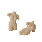 Beige ceramic torso and foot sculpture on a white background
