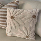 Decorative pillow with floral pattern on a couch