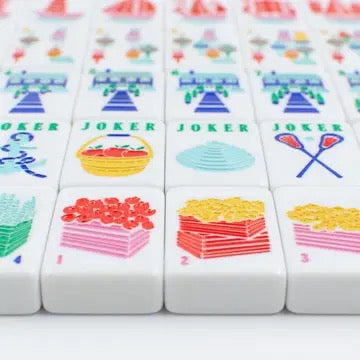 Set of colorful game tiles with 'Joker' and various symbols on a white background