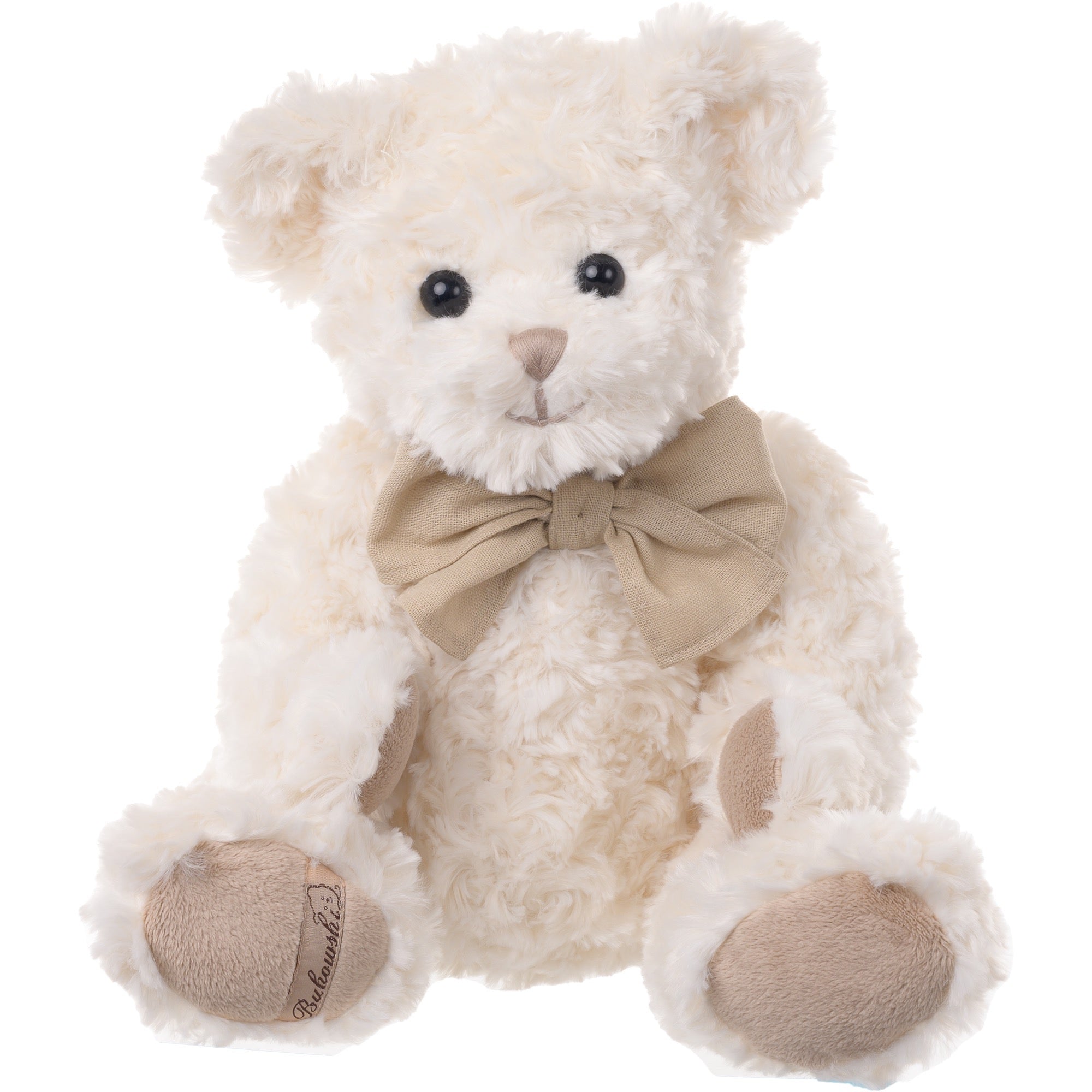 White teddy bear with a beige bow tie on a white background