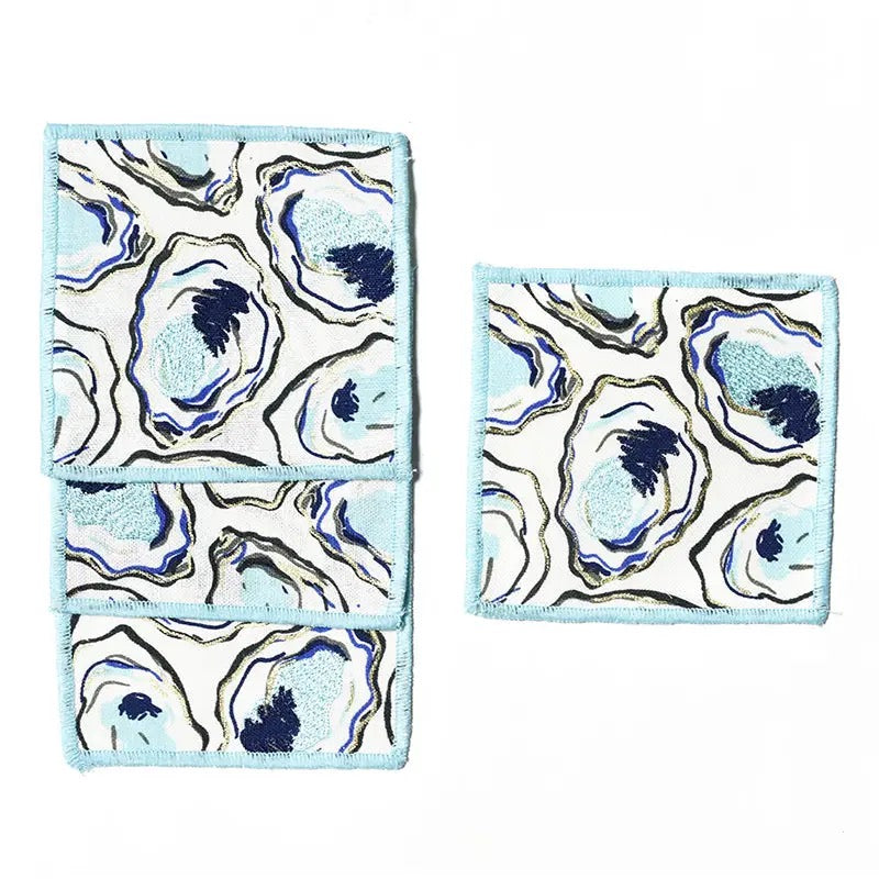 Set of three cloths with a blue and white abstract pattern on a white background