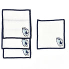 Two white napkins with blue oyster shell designs on a white background
