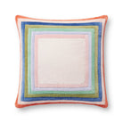 Multicolored square pillow with a white center on a white background