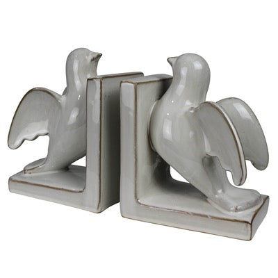 A pair of ceramic dove bookends in a light gray glaze with a rustic brown distressed edge, shown on a plain white background.
