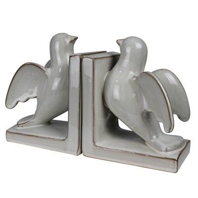 White ceramic bookends shaped like birds on a white background