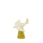 Decorative ceramic figure of a bird on a pedestal with a white background