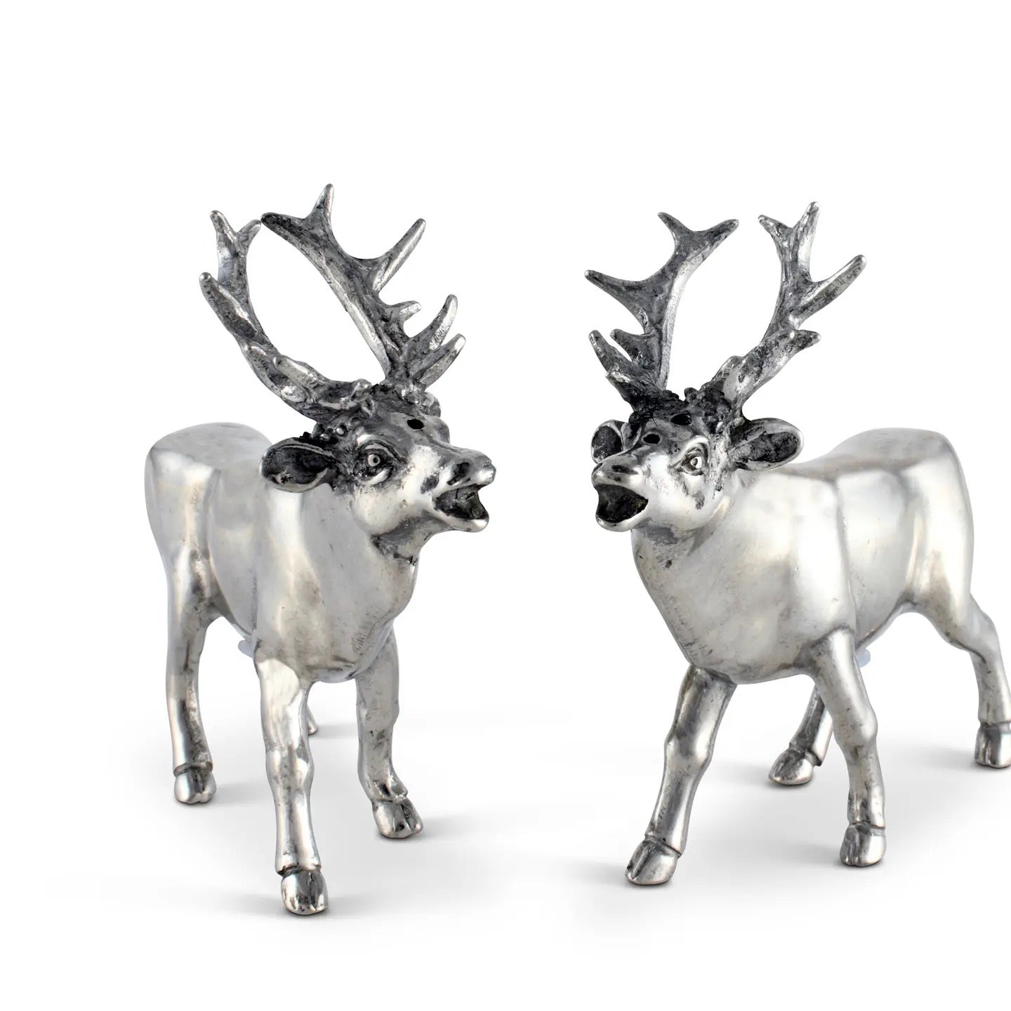 Two silver deer figurines with large antlers on a white background