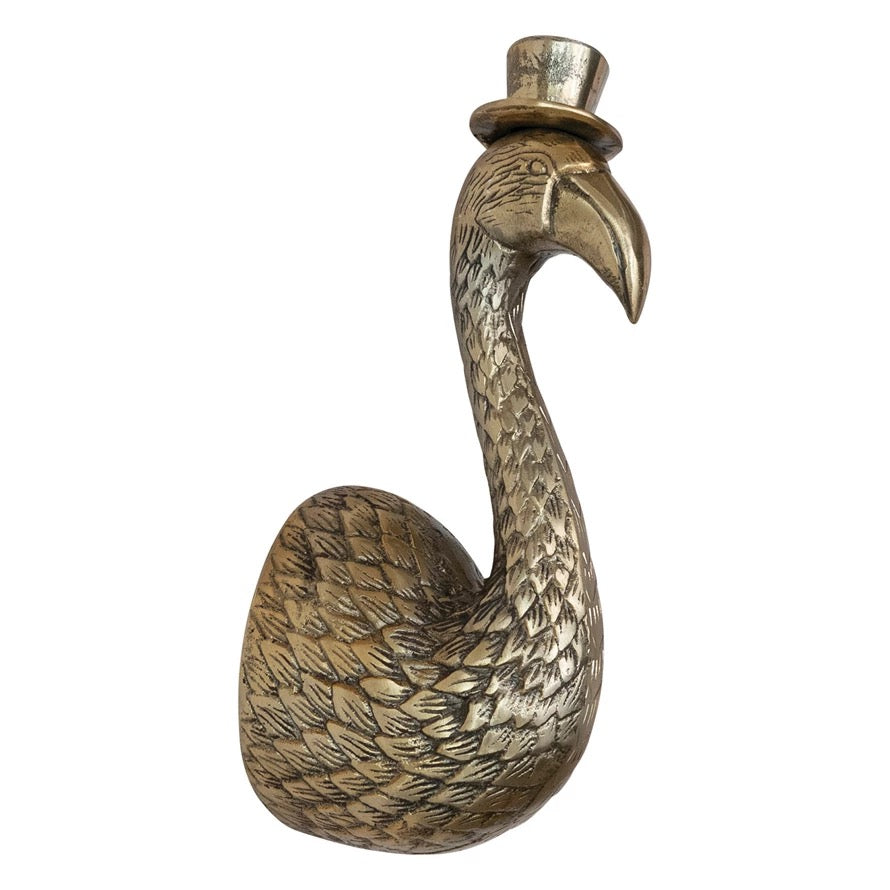 Bronze flamingo sculpture wearing a top hat on a white background