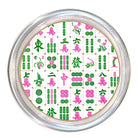A round silver-framed clock or wall decor piece featuring a Mahjong-style tile pattern in green, pink, and white on the face, shown against a plain white background.