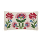 A rectangular hand-hooked wool pillow with a cream-colored base and a colorful floral pattern featuring red, pink, blue, and green flowers and leaves.