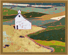 A framed landscape painting depicting a white farmhouse on rolling green and beige hills, with a winding fence and dark blue sky, shown in a light wood frame.