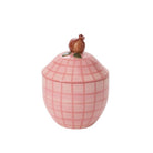 Pink checkered jar with a rooster on top against a white background