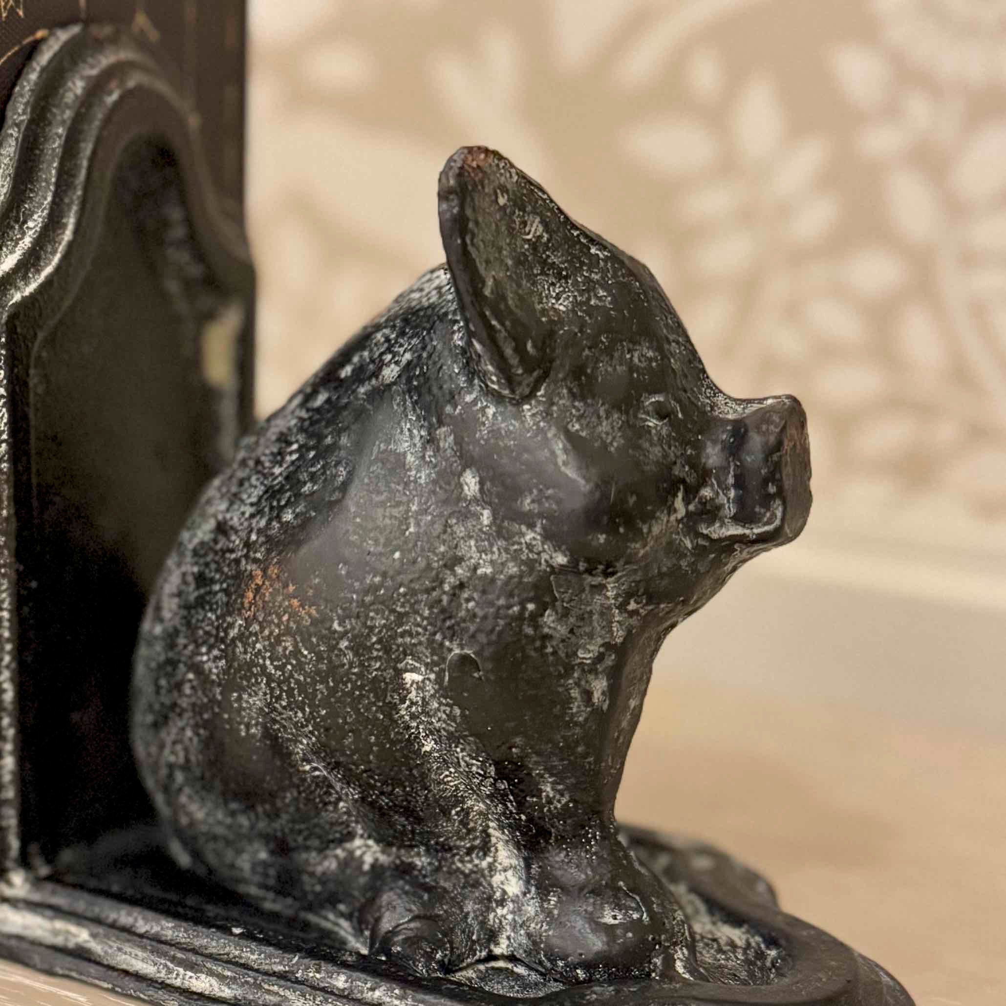 Decorative black pig sculpture on a textured surface
