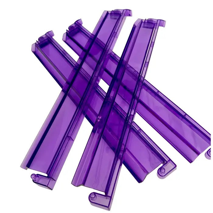Stack of purple plastic clips on a white background